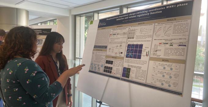 trainees at poster presentation